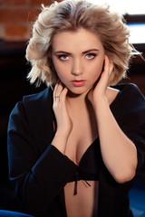 Fototapeta premium Blonde girl with curly hair/advertising