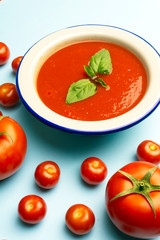 Gazpacho cold summer vegetarian tomato soup with basil in a bowl