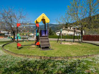 Children's playground with swings and slide