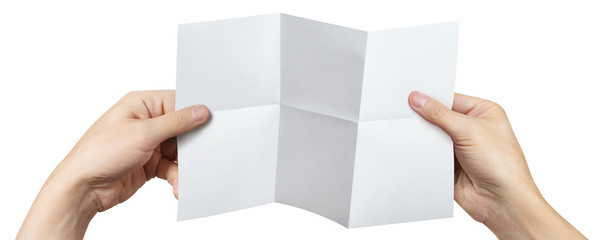 Hands holding a folded sheet of white paper, isolated on white background