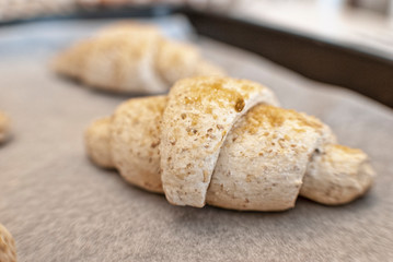 Raw croissant in the foreground