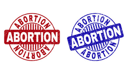Grunge ABORTION round stamp seals isolated on a white background. Round seals with grunge texture in red and blue colors. Vector rubber watermark of ABORTION caption inside circle form with stripes.
