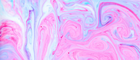 Abstract multicolored background. Screen saver. Fluid art with pink blue color. Blue pink texture. Colored paint stains in liquid