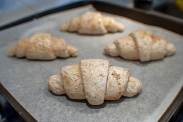 Raw croissant in the foreground