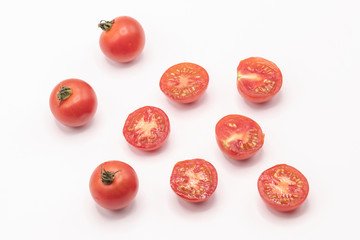 Fototapeta na wymiar Close up red tomatoes on isolate white background.Selective focus red tomatoes.