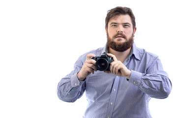 Obraz premium portrait of big handsome bearded photographer posing with professional DSLR camera, isolated on white