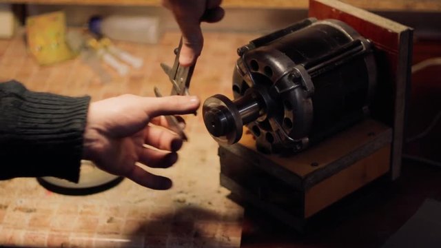 Getting rotary sharpening machine with diamond abrasive discs ready to work and free hand sharpening leatherman knife