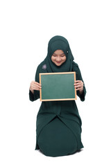 Malay woman wearing hijab with blank black board