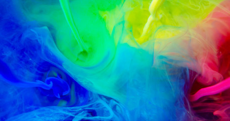 Fototapeta na wymiar Colorful Rainbow Paint Threads and Drops Mixing in Water. Ink swirling. Underwater 4K Macro Shot.