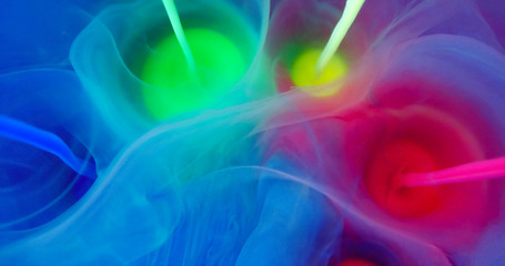 Colorful Rainbow Paint  Threads and Drops Mixing in Water. Ink swirling. Underwater 4K Macro Shot.