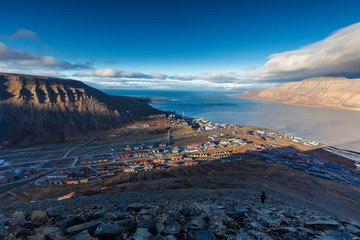 Hiking along the mountains - View over Longyearbyen and adventdalen fjord from above - the most...