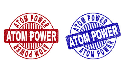 Grunge ATOM POWER round stamp seals isolated on a white background. Round seals with grunge texture in red and blue colors. Vector rubber watermark of ATOM POWER text inside circle form with stripes.