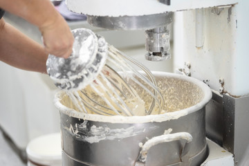 kneading dough in bakery dough mixer machine .
