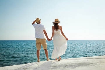 Romantic young couple watching the sea