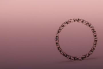 Selective focus close up ring on pink background.
