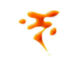 sweet caramel sauce isolated on white background Top view or flat lay. Caramel isolated on white...