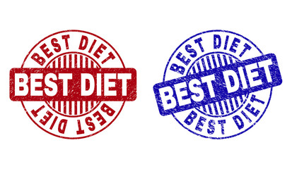 Grunge BEST DIET round stamp seals isolated on a white background. Round seals with grunge texture in red and blue colors. Vector rubber imitation of BEST DIET label inside circle form with stripes.