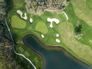 Aerial photo of green golf fields in spring
