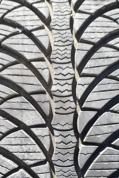 Close-up winter tire tread. Textured tire tread. Part of brand new modern winter car tire.