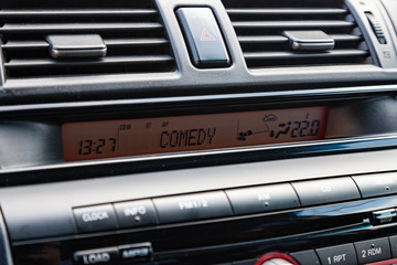 The interior of the car with a view of the dashboard and multimedia system with light gray trim