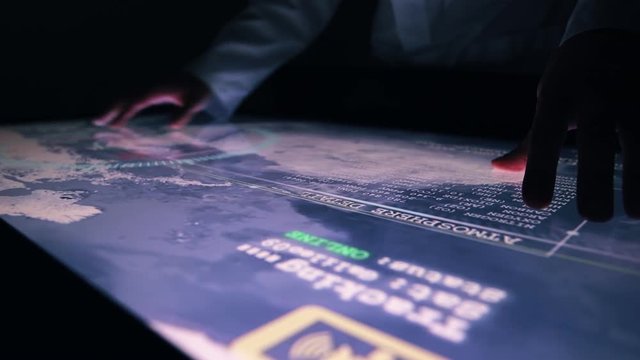 Man Indicators On Sensor Touch Screen Sensory Interactive Table In The Dark. 