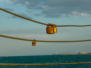Obraz premium Interesting locks on a rope in Italy