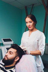 Treatment of baldness with beauty injections. Mesotherapy. Plasma lifting.