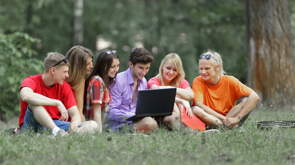 Fototapeta premium Group of college students studying together on campus ground