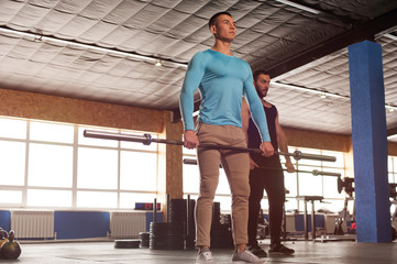 Fototapeta premium Fit Healthy Men Training Together in Gym.