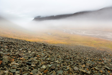 stony mountains, Rivers winding smooth through Bjorndalen, clouds in the mountain, Fall in...