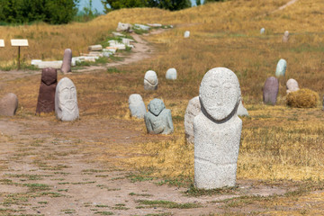 Tokmok, Kyrgyzstan - Aug 08 2018: Kurgan stelae at Ruins of Balasagun in Tokmok, Kyrgyzstan. Balasagun is part of the World Heritage Site-Silk Roads: the Routes Network of Chang'an-Tianshan Corridor.