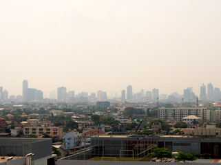 Fototapeta na wymiar Cityscape urban skyline in the mist or smog. Wide and High view image of Bangkok city in the smog