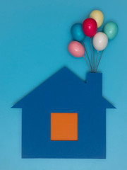 Haus mit Luftballon.