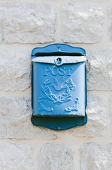 A blue mail box.