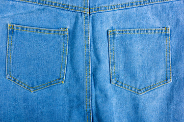 Blue washed faded jeans texture with seams
