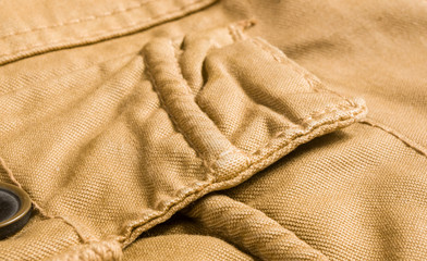 clothing items washed cotton fabric texture with seams, clasps, buttons and rivets