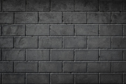 Background of smoothly laid cinder blocks. Wall of bricks with vignetting.