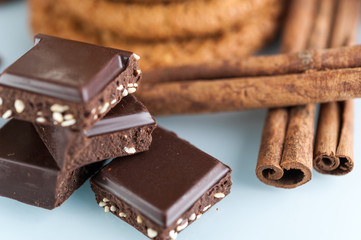 Various shortbread, oat cookies, chocolate chip biscuit and pieces of chocolate with seeds and nuts.