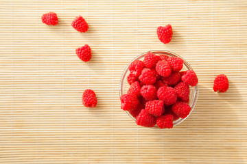 Glass of fresh raspberries for healthy dessert