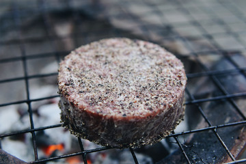 Beef grilled on a charcoal stove. Barbecue hamburger.
