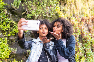 Mother Taking a Selfie with Daughter.