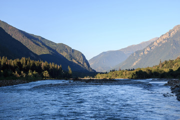 Fototapeta premium Panorama view of river scene in mountains of national park Dombay, Caucasus