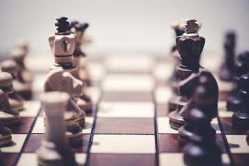 black against white chess pieces on chess board