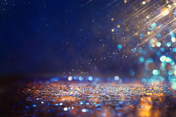 Obraz premium glitter vintage lights background. black, purple, blue and gold. de-focused