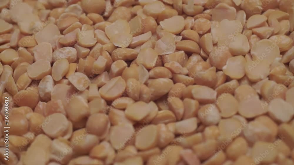 Poster chopped dried peas background. macro view. rotation 360 degrees.