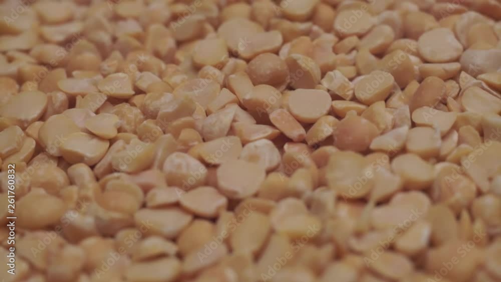 Poster chopped dried peas background. macro view. rotation 360 degrees.