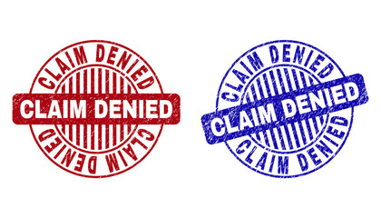 Grunge CLAIM DENIED round stamp seals isolated on a white background. Round seals with grunge texture in red and blue colors.