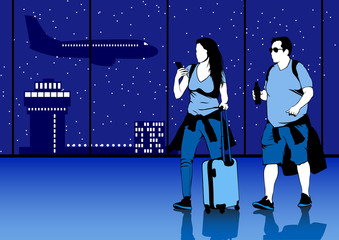 Man and woman with a suitcase at airport