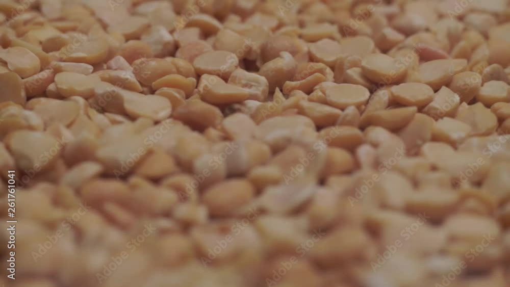 Poster Chopped dried peas background. Macro view. Rotation 360 degrees.