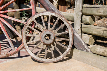 Fototapeta na wymiar Old wooden wheel isolated on white background.